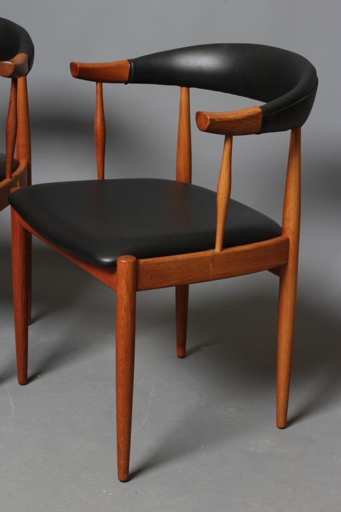 A PAIR OF TEAK ELBOW CHAIRS, mid 20th century, the open padded cow horn back and seat in black - Image 2 of 2