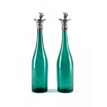 A PAIR OF VICTORIAN BRISTOL GREEN GLASS BOTTLE DECANTERS, maker Thomas Bradbury & Sons, Sheffield