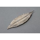A STERLING SILVER MONEY CLIP, maker Tiffany & Co., cast in the form of a leaf, 2 1/2" long (Est.