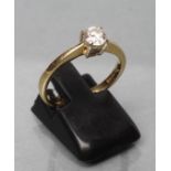 A SOLITAIRE DIAMOND RING, the brilliant cut stone of approximately 0.6cts claw set to a plain 18ct