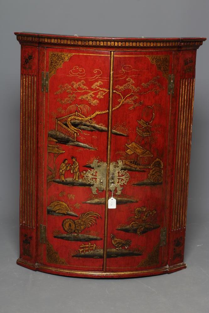 A GEORGIAN RED LACQUERED CORNER CUPBOARD, late 18th century, of quadrant form painted and gilded