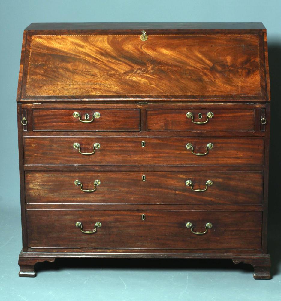 A GEORGIAN MAHOGANY BUREAU, late 18th century, the banded fallfront with parquetry stringing opening