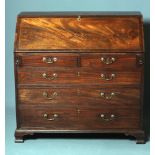 A GEORGIAN MAHOGANY BUREAU, late 18th century, the banded fallfront with parquetry stringing opening