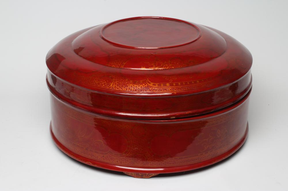 A LARGE VIETNAMESE RED LACQUER BETEL BOX AND COVER, modern, of plain cylindrical form with lift-