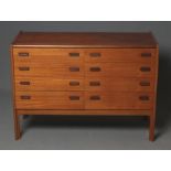 A TEAK CABINET, mid 20th century, comprising two banks each of four graduated drawers with formosa