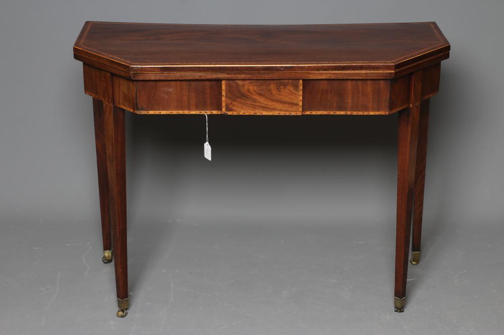 A GEORGIAN MAHOGANY FOLDING CARD TABLE, late 18th century, the canted oblong top with chequer