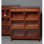 A PAIR OF MAHOGANY BOOKCASES, early 20th century, each with six glazed folding doors enclosing three