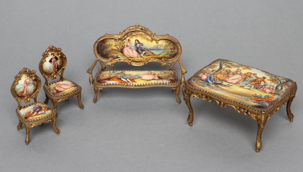 AN AUSTRIAN GILT METAL AND ENAMEL MINIATURE BOUDOIR SET, painted in colours with figures in 18th
