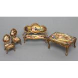 AN AUSTRIAN GILT METAL AND ENAMEL MINIATURE BOUDOIR SET, painted in colours with figures in 18th