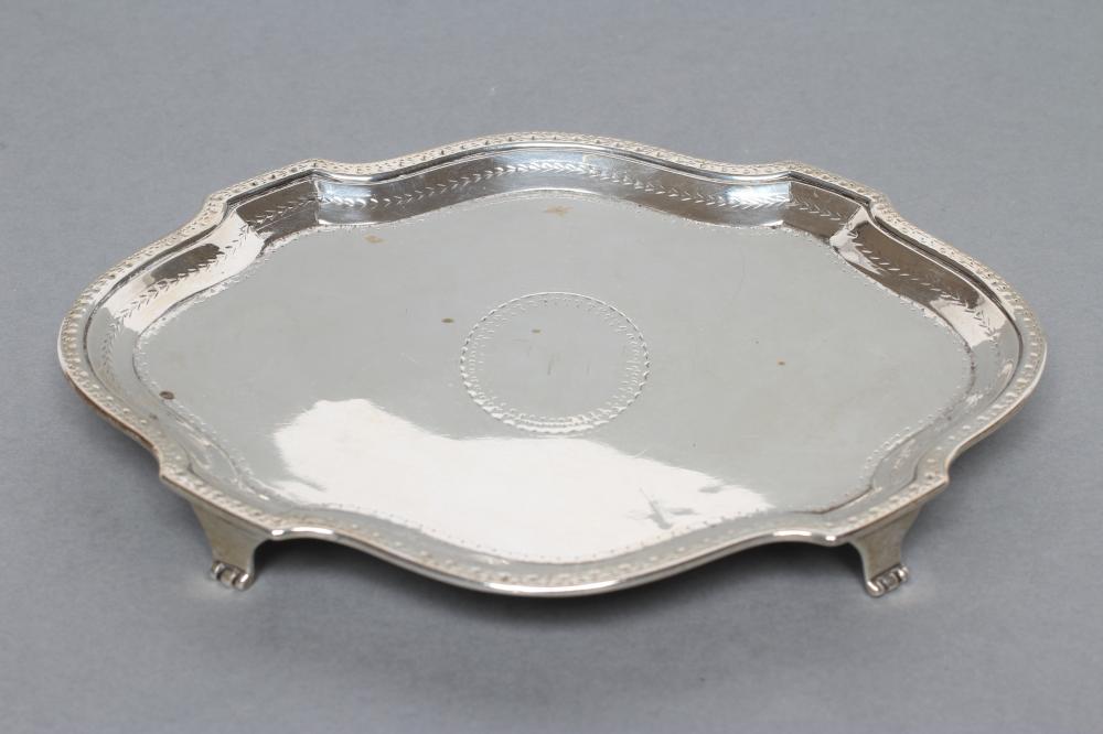 A GEORGE III TEAPOT STAND, maker's mark BM (Jackson states un-traced), London 1783, of lobed oval