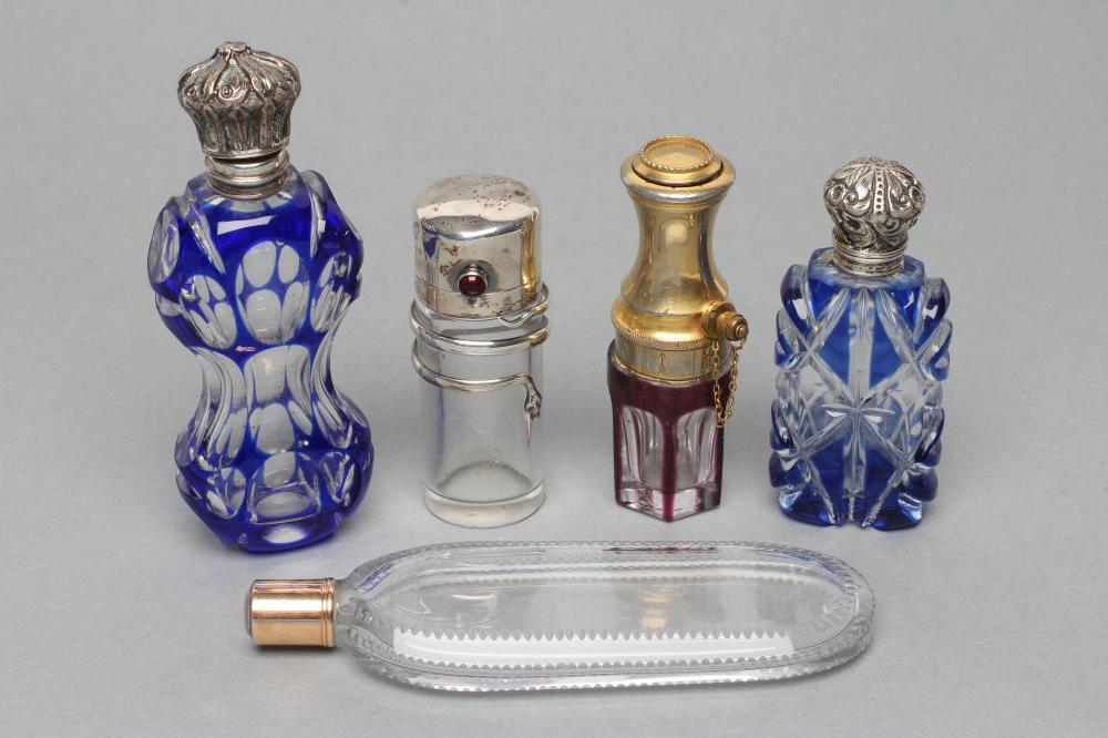 A COLLECTION OF GEORGIAN AND LATER GLASS SCENT BOTTLES, comprising "Le Parisien"- a ruby overlay