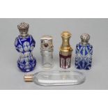 A COLLECTION OF GEORGIAN AND LATER GLASS SCENT BOTTLES, comprising "Le Parisien"- a ruby overlay