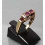 A RUBY RING, the four calibre cut stones channel set with two small diamond point spacers to a plain