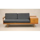 A GUY ROGERS TEAK LOUNGE SUITE comprising a pair of arm chairs button upholstered in deep blue