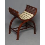 AN EDWARDIAN X FRAMED MAHOGANY DRESSING STOOL WITH MARQUETRY and stringing, scrolled sides on