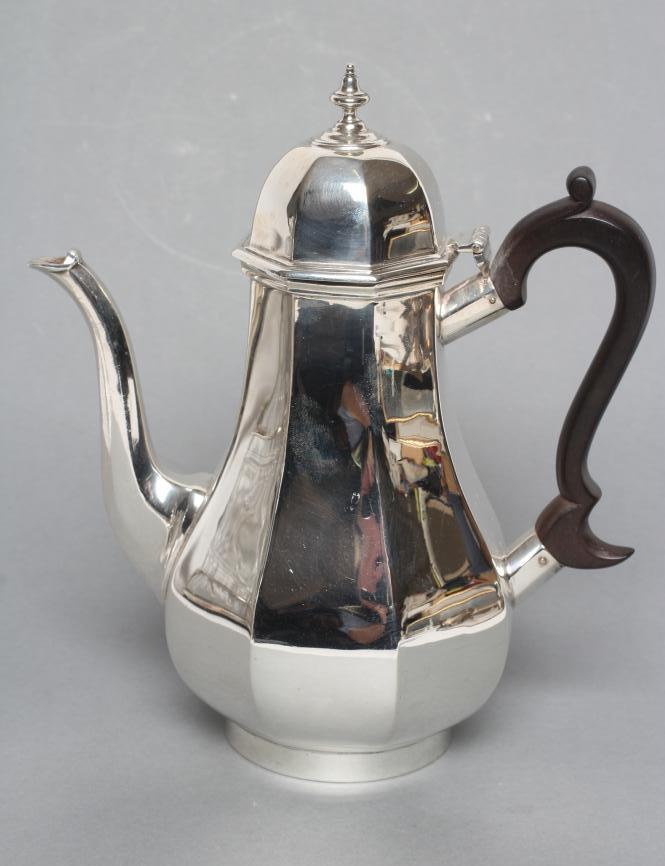 A COFFEE POT, maker's mark indistinct (Hs), London 1924, of plain octagonal form with hinged high