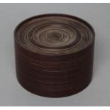 A TREEN BOX, c.1900(?), of cylindrical form with incised line banding and moulded detachable lid.