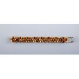 A 9CT GOLD AND CITRINE BRACELET, the twenty four step cut citrines claw set to bow shaped links,