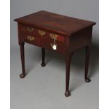 A GEORGIAN MAHOGANY LOW BOY, 18th century and possibly later, the moulded edged veneered top over