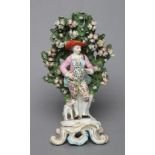 A CHELSEA PORCELAIN FIGURE, c.1765, modelled as a young gentleman wearing a broad brimmed hat,