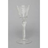 A JACOBITE WINE GLASS, mid 18th century, the round funnel bowl engraved with a rose and star, on