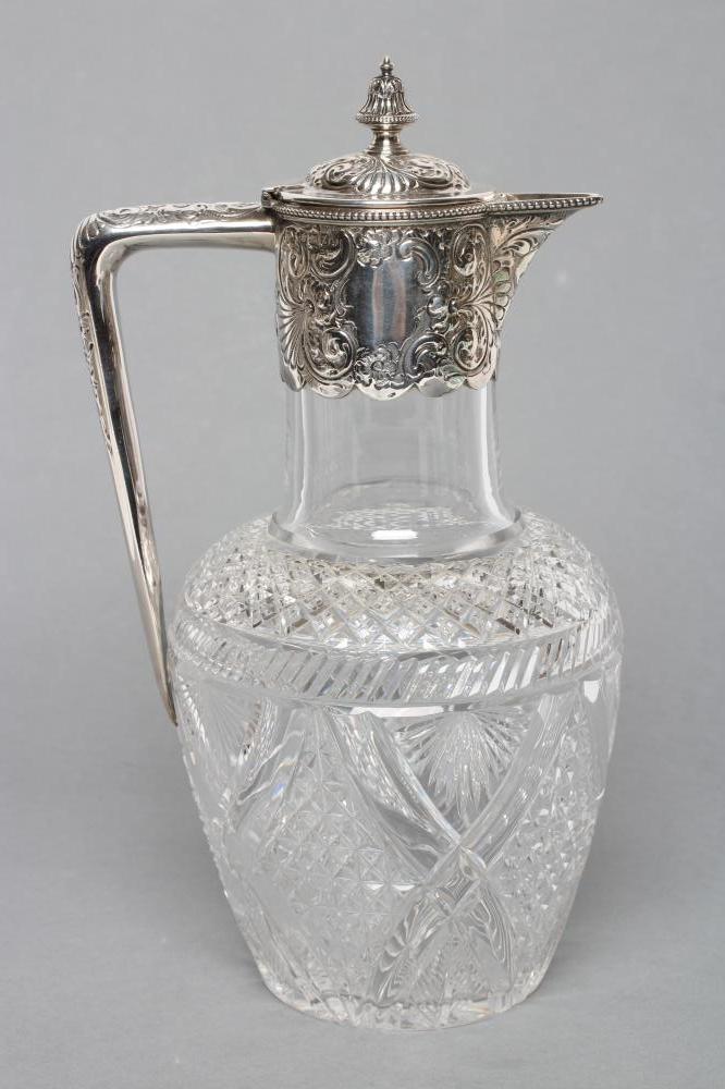 A LATE VICTORIAN GLASS CLARET JUG, maker Atkin Bros., Sheffield 1892, of baluster form with slice,