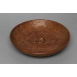 A ROBERT THOMPSON ADZED OAK BOWL of shallow circular form, carved mouse trademark in high relief