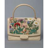 A GUCCI HANDBAG, c.1970, made under licence, in tightly woven cream cane, short handle, the flap and