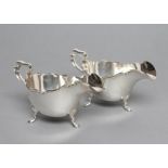 A PAIR OF SAUCEBOATS, maker Atkin Bros., Sheffield 1936, the oval bowl with cast and applied rims,
