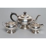 A THREE PIECE TEA SERVICE, maker's mark P. Bros., Sheffield 1945, of squat globular form on