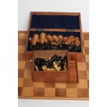 A TURNED WOOD CHESS SET in box and hardwood, kings 3 3/4" high, in a blue velvet lined mahogany