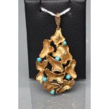 A MODERNIST ABSTRACT PENDANT of open tear drop form claw set with six turquoise beads, stamped