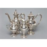 AN ITALIAN FOUR PIECE EMPIRE STYLE TEA SET, stamped 800, of pedestal vase form with stiff leaf