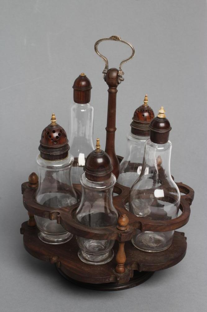 A GEORGIAN HARDWOOD FIVE BOTTLE CRUET AND STAND, late 18th century, the original clear glass