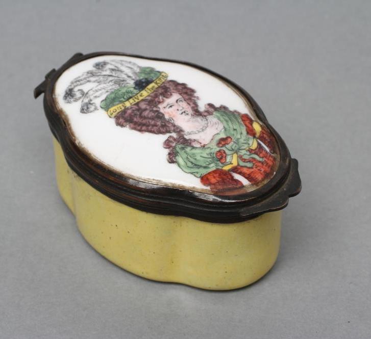 A STAFFORDSHIRE STYLE ENAMEL BOX, late 19th century, of shaped oval form, the cover painted with the