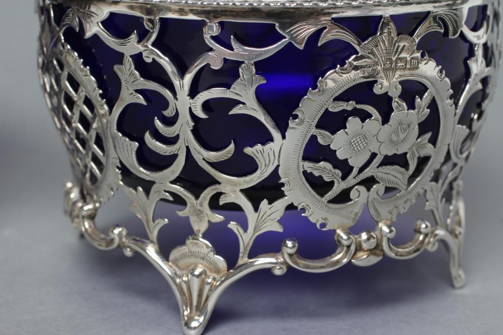 A MATCHED PAIR OF SWEETMEAT BASKETS, maker Mappin & Webb, Birmingham 1911, and maker's mark D & ?, - Image 2 of 3