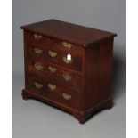 A SMALL MAHOGANY STRAIGHT FRONT CHEST, 18th century and later, the rounded moulded edged top over