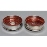 A PAIR OF BOTTLE COASTERS, maker Carrs, Sheffield 2000, of plain cylindrical form with turned