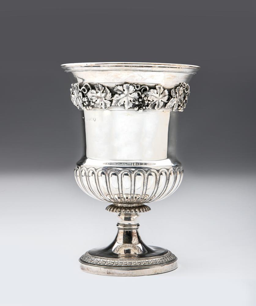 A GEORGE IV WINE COOLER, maker's mark WE, London 1821, the semi-ribbed campana pedestal urn with