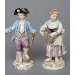 TWO MEISSEN PORCELAIN FIGURES, late 19th century, modelled as a young gardener in 18th century style