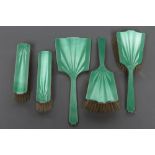 AN ART DECO SILVER AND GREEN ENAMEL COMPOSITE FIVE PIECE DRESSING TABLE SET, maker Henry Clifford