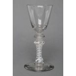 A COMPOSITE WINE GLASS, mid 18th century, the round funnel bowl on annulated knop over a further