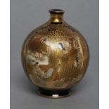 A SATSUMA EARTHENWARE VASE of globular form, painted in typical palette and richly gilded with two