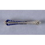 AN ART DECO SAPPHIRE AND DIAMOND BROOCH, probably French, channel set with graduated calibre cut