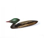 GUY TAPLIN (b.1939), "Merganser", a carved and painted model of a duck with inset black glass