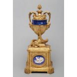 A FRENCH GILT METAL AND PORCELAIN LOUIS XVI STYLE URN CLOCK, 19th century, the blue annular dial