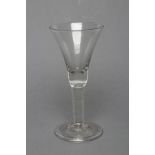 A GLASS GOBLET, mid 18th century, the bell bowl on plain stem and folded domed foot, 8" high (Est.
