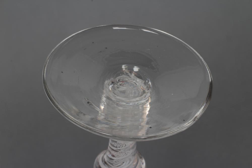 A COMPOSITE WINE GLASS, mid 18th century, the round funnel bowl on annulated knop over a further - Image 3 of 3