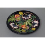 A MOORCROFT POTTERY QUEENS CHOICE PATTERN SMALL CHARGER, 2010, of plain circular form, tubelined and