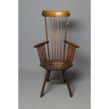 A COMB BACK WINDSOR ARMCHAIR, in the Arts & Crafts style, c.1900, with curved top rail, shaped